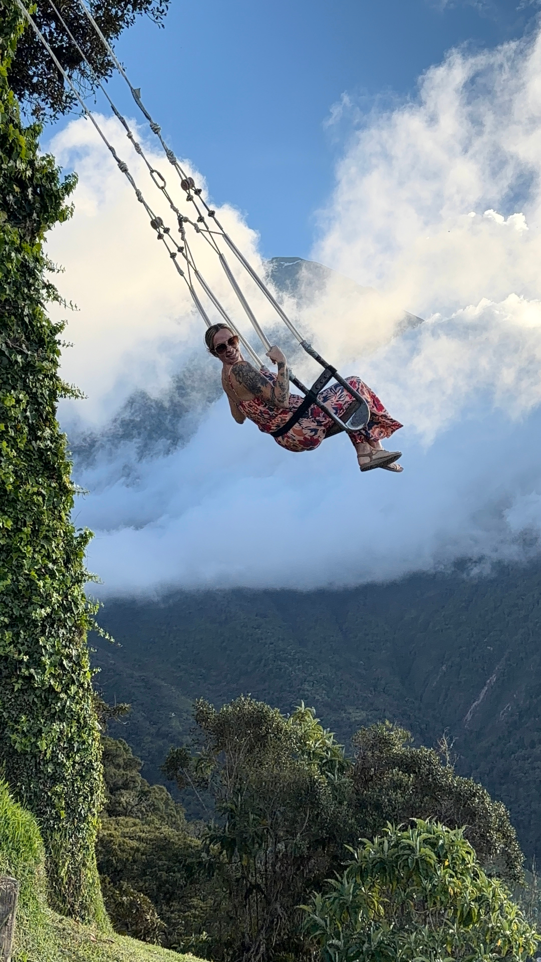 Alyssa on a swing over the clouds in Ecuador